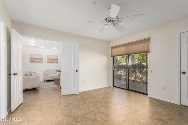 9460 E Mission Ln Unit 115, Scottsdale, AZ 85258 - unfurnished room with ceiling fan and light tile patterned flooring