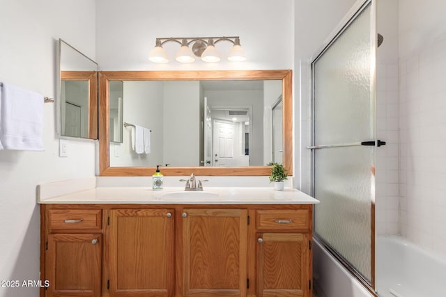 9460 E Mission Ln Unit 115, Scottsdale, AZ 85258 - bathroom featuring vanity and shower / bath combination with glass door