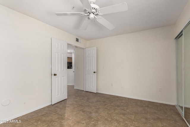 9460 E Mission Ln Unit 115, Scottsdale, AZ 85258 - unfurnished bedroom with a closet and a ceiling fan