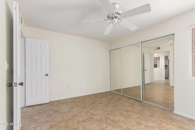 9460 E Mission Ln Unit 115, Scottsdale, AZ 85258 - unfurnished bedroom with a closet and a ceiling fan