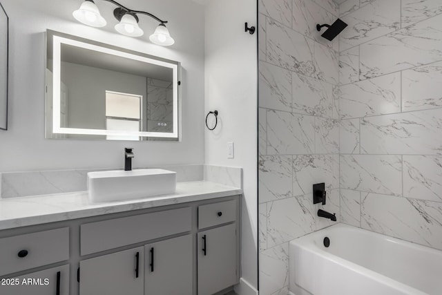 bathroom featuring bathtub / shower combination and vanity