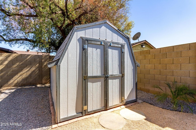 view of shed featuring a fenced backyard