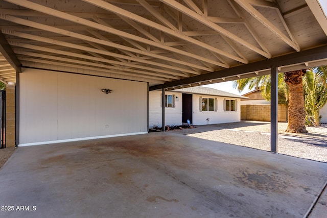 view of patio with fence and an attached carport