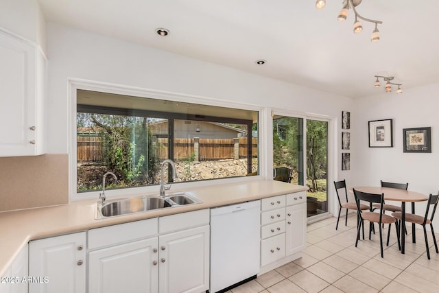 6802 N 26th St, Phoenix, AZ 85016 - kitchen featuring dishwasher, light tile patterned floors, light countertops, and healthy amount of natural light