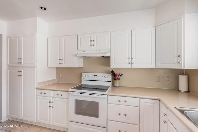 6802 N 26th St, Phoenix, AZ 85016 - kitchen with white range with electric cooktop, under cabinet range hood, white cabinets, and recessed lighting