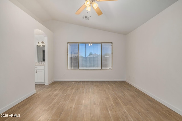 16120 N 86th Ln, Peoria, AZ 85382 - empty room featuring ceiling fan, light wood-style floors, lofted ceiling, a sink, and baseboards