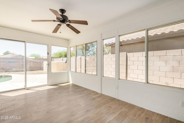 16120 N 86th Ln, Peoria, AZ 85382 - unfurnished sunroom featuring a ceiling fan