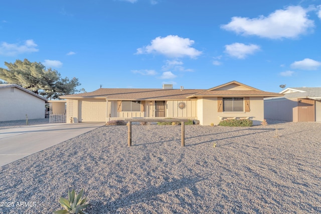 ranch-style home featuring a garage