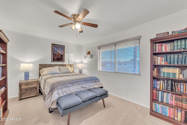 bedroom featuring ceiling fan, light colored carpet, and brick wall