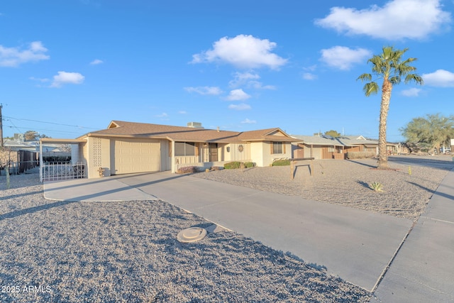 view of front of home featuring a carport and a garage