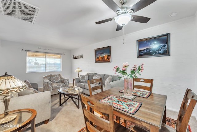 carpeted living room featuring ceiling fan