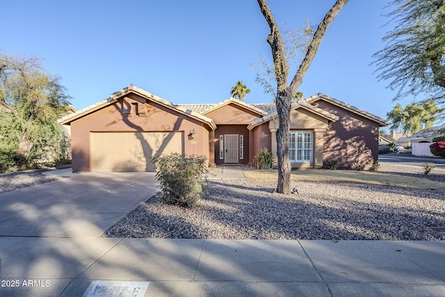 ranch-style home featuring a garage