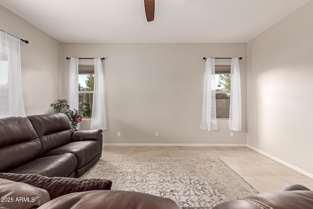 tiled living room with ceiling fan