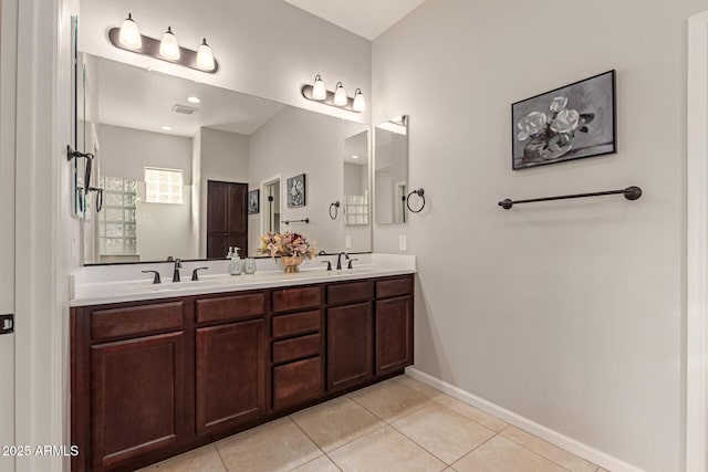 bathroom featuring tile patterned flooring and vanity