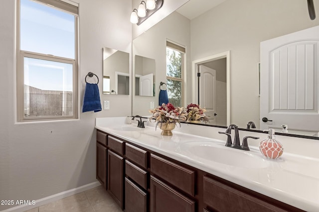 bathroom featuring tile patterned flooring and vanity