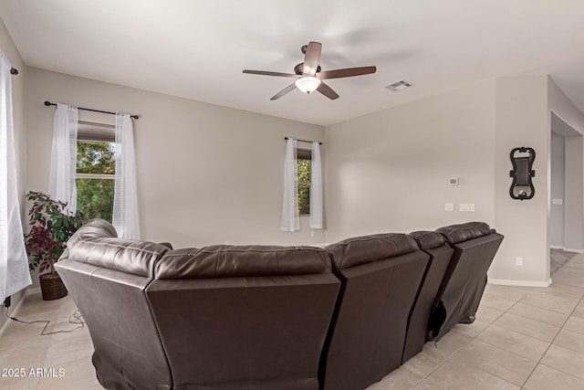 tiled living room with ceiling fan