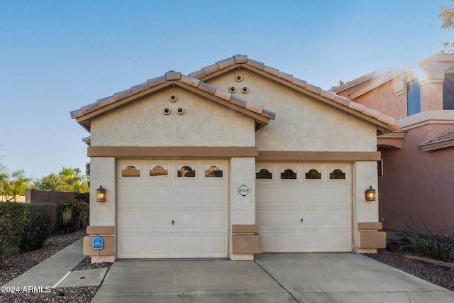 view of front of home with a garage