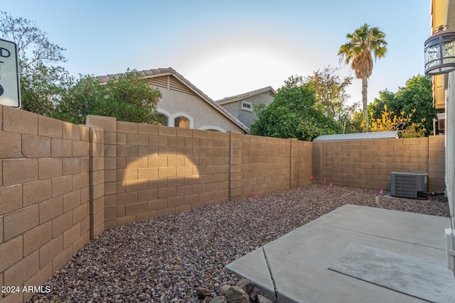 view of yard with a patio and central AC