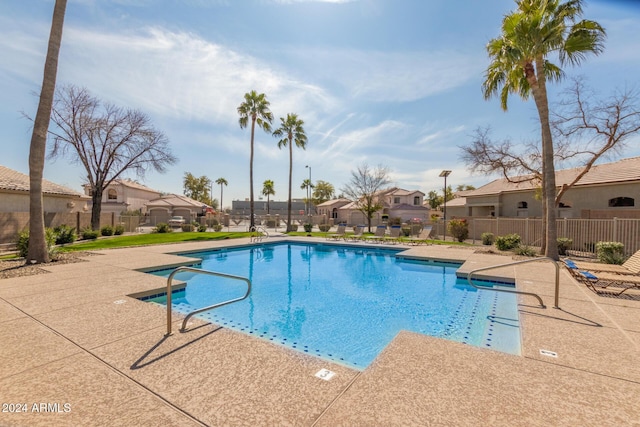 view of swimming pool with a patio area