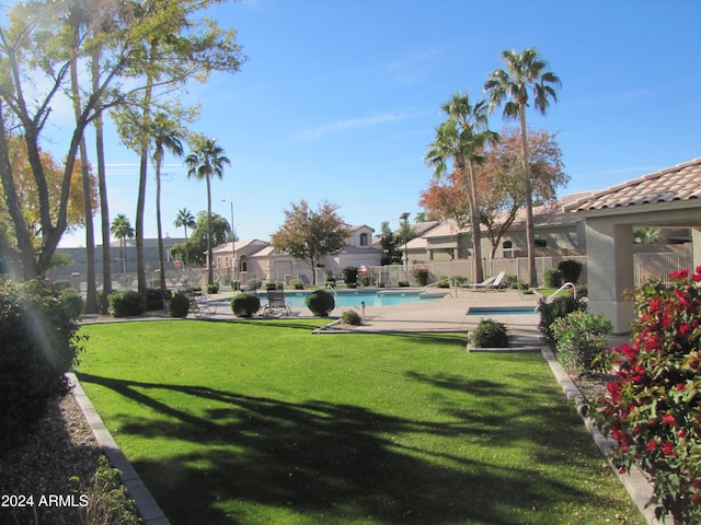 view of yard featuring a community pool