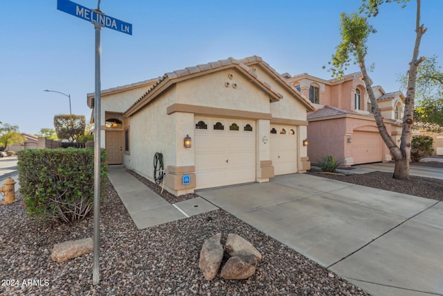 view of front of property with a garage