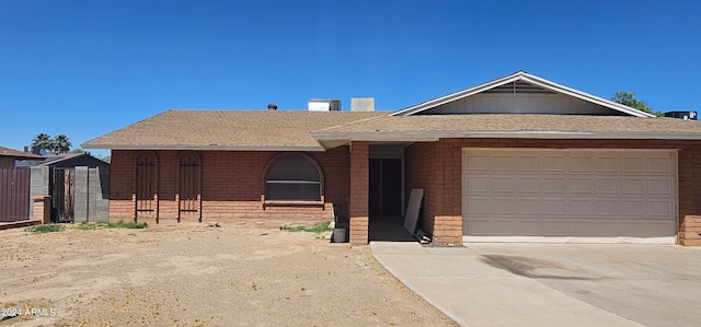 ranch-style house featuring a garage