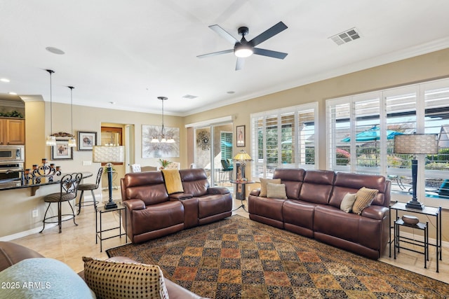 living room with ceiling fan with notable chandelier and ornamental molding