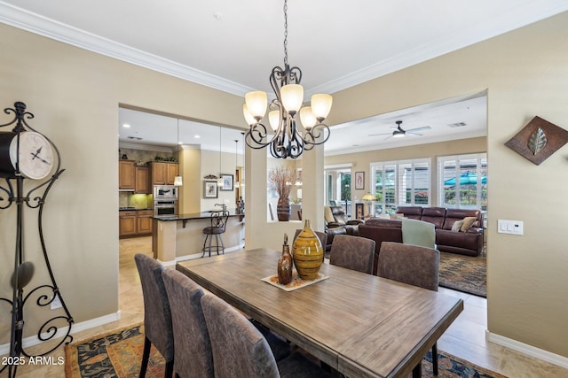 tiled dining space featuring an inviting chandelier and ornamental molding