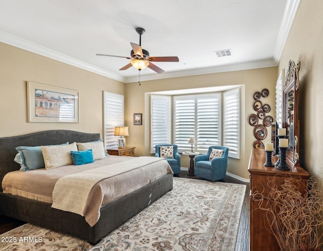 bedroom with ceiling fan, crown molding, and hardwood / wood-style floors