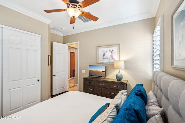 bedroom featuring a closet, ceiling fan, and ornamental molding