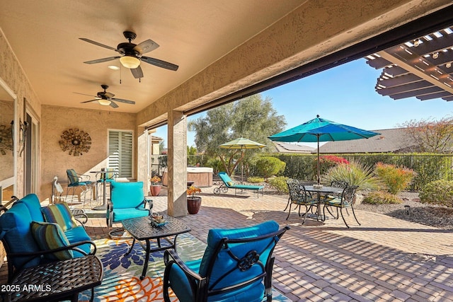 view of patio featuring ceiling fan