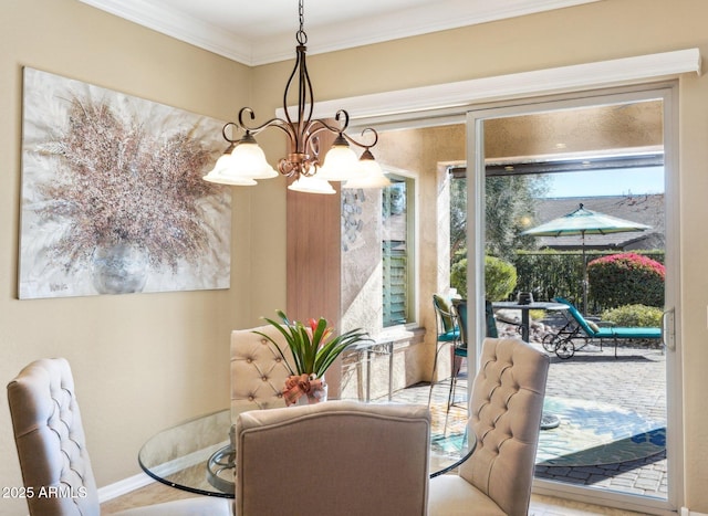 dining space with a chandelier and crown molding