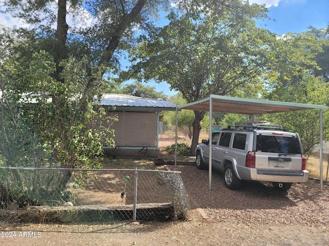 view of parking / parking lot with a carport