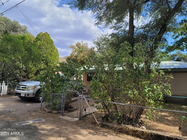 view of property hidden behind natural elements