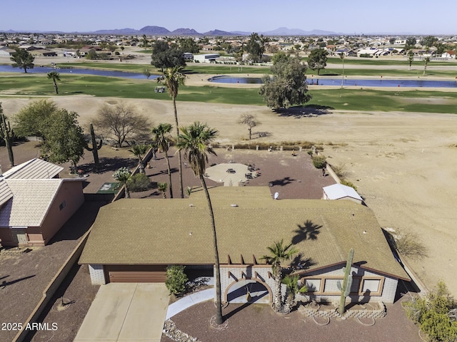 birds eye view of property featuring golf course view and a mountain view