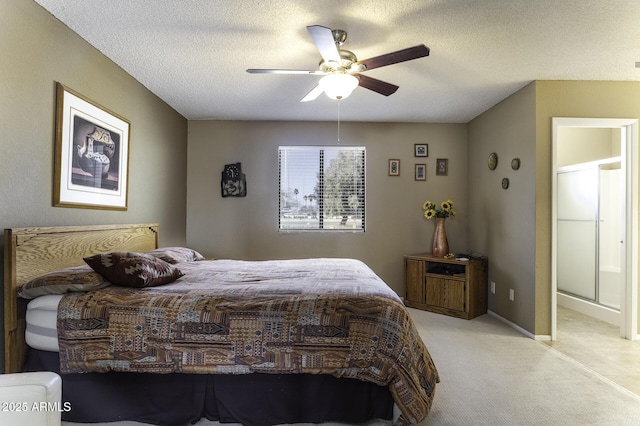 bedroom with baseboards, light colored carpet, a textured ceiling, and ceiling fan