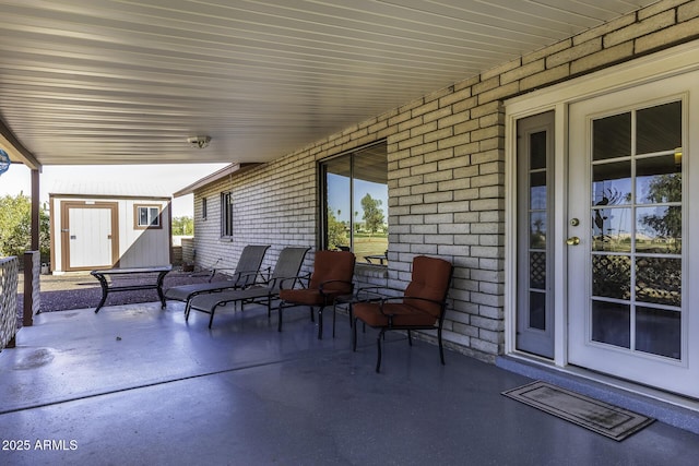 view of patio / terrace with an outbuilding