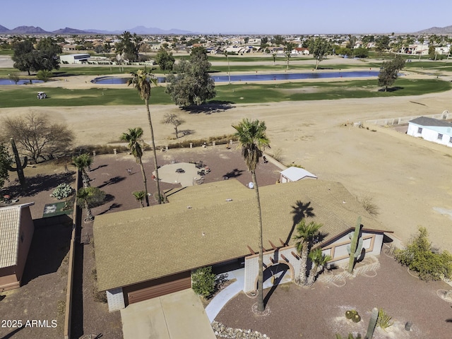 birds eye view of property featuring a mountain view