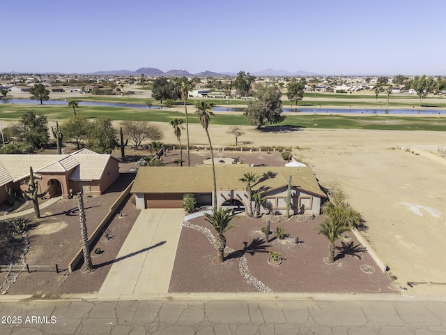 bird's eye view featuring a mountain view and golf course view