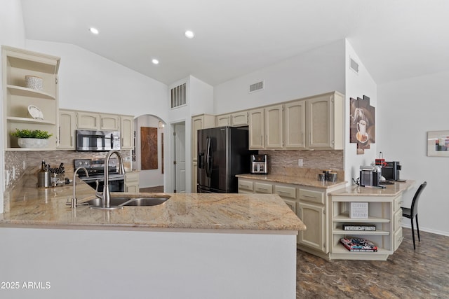 kitchen with open shelves, tasteful backsplash, appliances with stainless steel finishes, and a peninsula