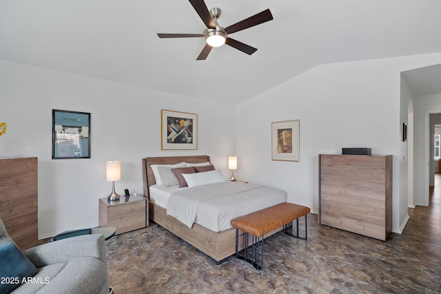 bedroom featuring vaulted ceiling, baseboards, and a ceiling fan