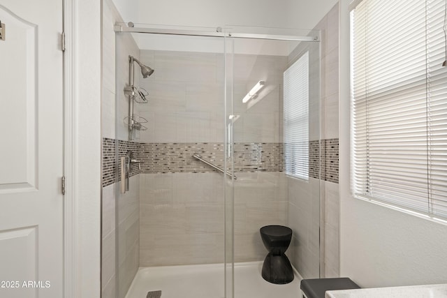 full bath featuring a shower stall