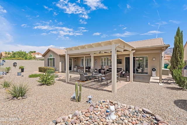 rear view of house with a tile roof, an outdoor hangout area, a pergola, and stucco siding