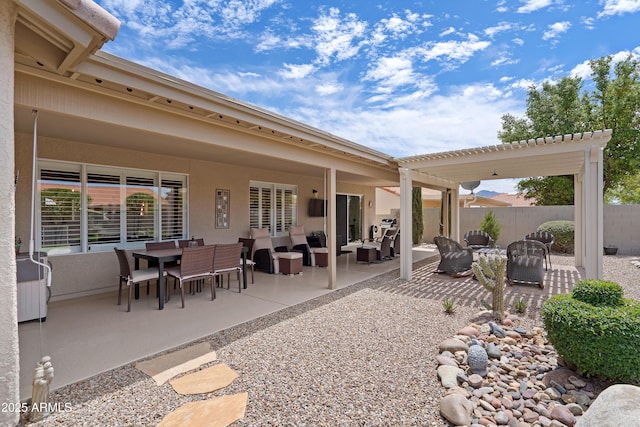 view of patio / terrace featuring outdoor dining area, fence, and an outdoor hangout area