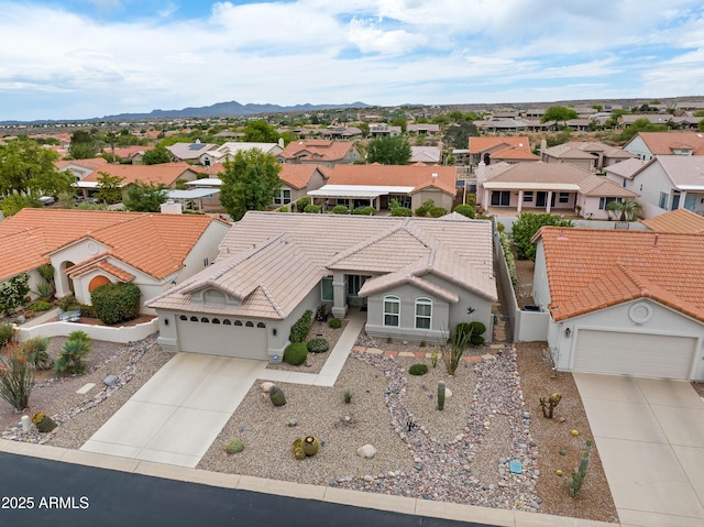 drone / aerial view featuring a mountain view and a residential view