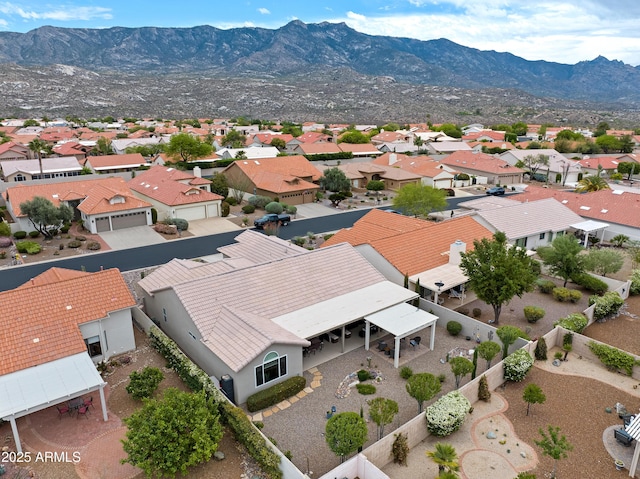 birds eye view of property featuring a mountain view and a residential view