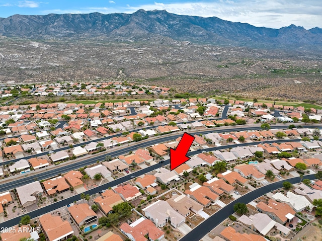 drone / aerial view featuring a mountain view and a residential view