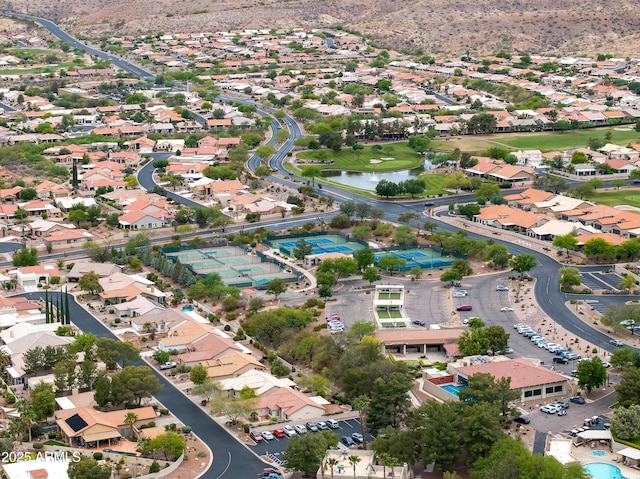drone / aerial view with a residential view and a water view