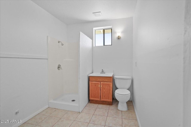 724 N Pine St, Gilbert, AZ 85233 - full bath with a tile shower, toilet, and tile patterned flooring
