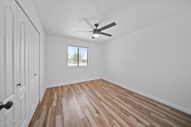724 N Pine St, Gilbert, AZ 85233 - unfurnished bedroom featuring a closet, light wood-type flooring, and baseboards